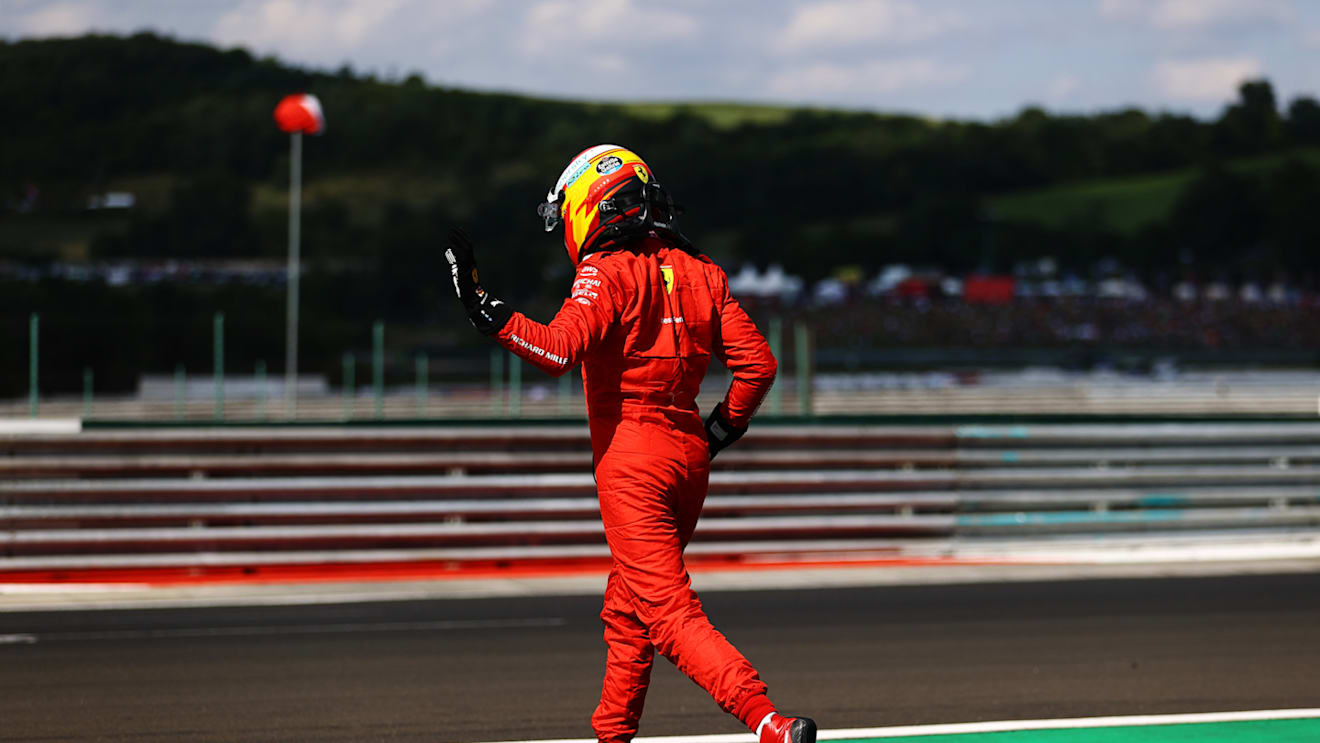 BUDAPEST, HUNGARY - JULY 31: Carlos Sainz of Spain driving the (55) Scuderia Ferrari SF21 walks from his car after a crash during qualifying ahead of the F1 Grand Prix of Hungary at Hungaroring on July 31, 2021 in Budapest, Hungary. (Photo by Bryn Lennon/Getty Images)