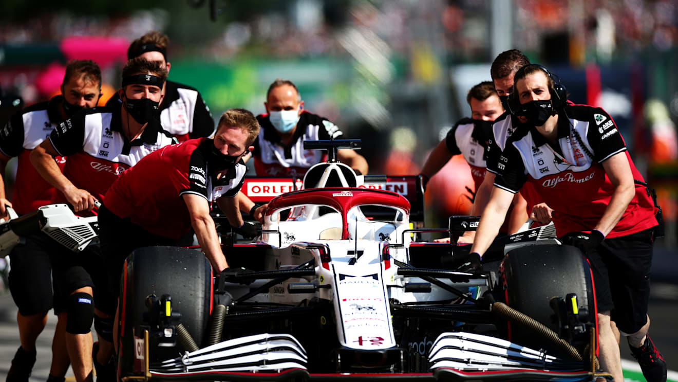 BUDAPEST, HUNGARY - JULY 31: The car of Kimi Raikkonen of Finland and Alfa Romeo Racing is pushed down the pitlane during qualifying ahead of the F1 Grand Prix of Hungary at Hungaroring on July 31, 2021 in Budapest, Hungary. (Photo by Peter Fox/Getty Images)