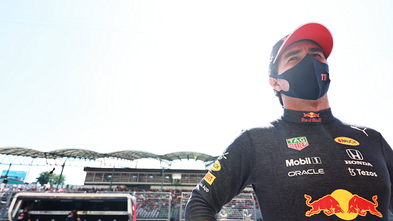 BUDAPEST, HUNGARY - JULY 31: Sergio Perez of Mexico and Red Bull Racing looks on in the Pitlane during qualifying ahead of the F1 Grand Prix of Hungary at Hungaroring on July 31, 2021 in Budapest, Hungary. (Photo by Mark Thompson/Getty Images)