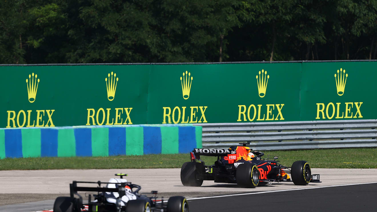 BUDAPEST, HUNGARY - AUGUST 01: Max Verstappen of the Netherlands driving the (33) Red Bull Racing RB16B Honda runs wide during the F1 Grand Prix of Hungary at Hungaroring on August 01, 2021 in Budapest, Hungary. (Photo by Bryn Lennon/Getty Images)