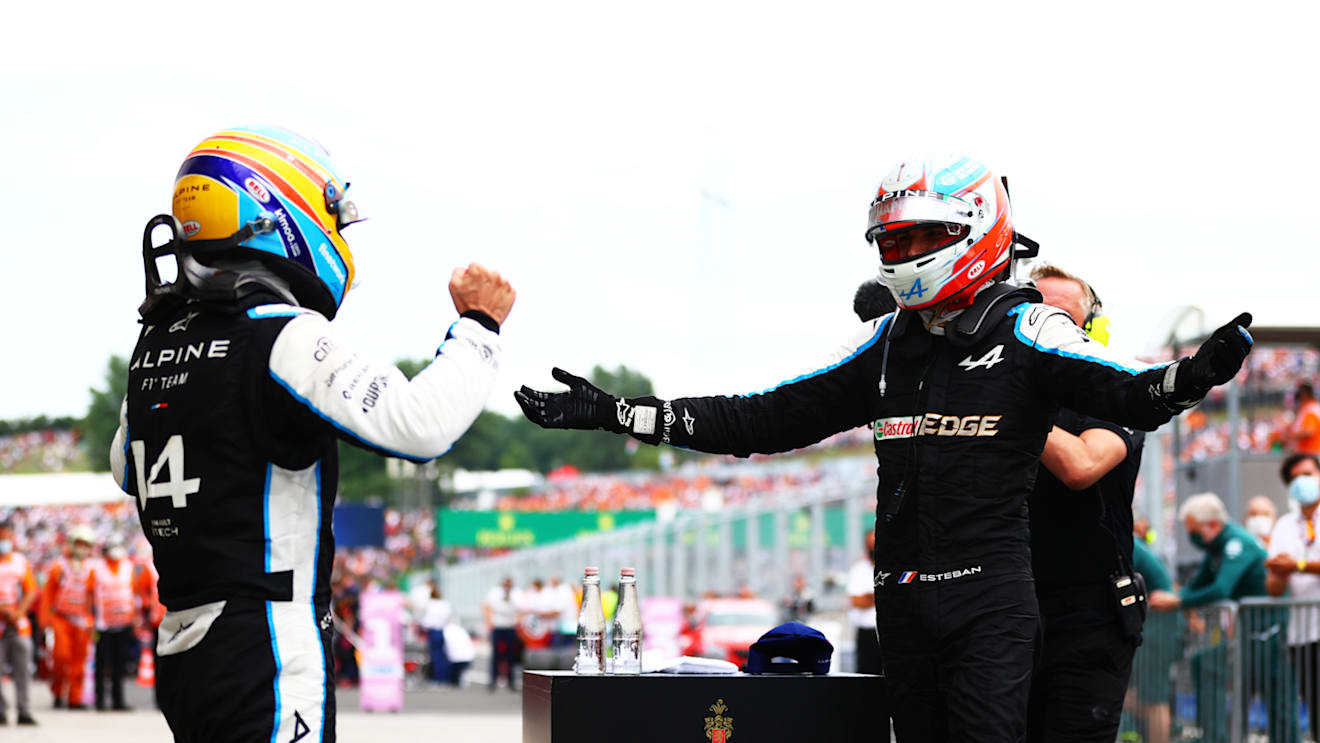 BUDAPEST, HUNGARY - AUGUST 01: Race winner Esteban Ocon of France and Alpine F1 Team and fifth placed Fernando Alonso of Spain and Alpine F1 Team celebrate in parc ferme during the F1 Grand Prix of Hungary at Hungaroring on August 01, 2021 in Budapest, Hungary. (Photo by Dan Istitene - Formula 1/Formula 1 via Getty Images)