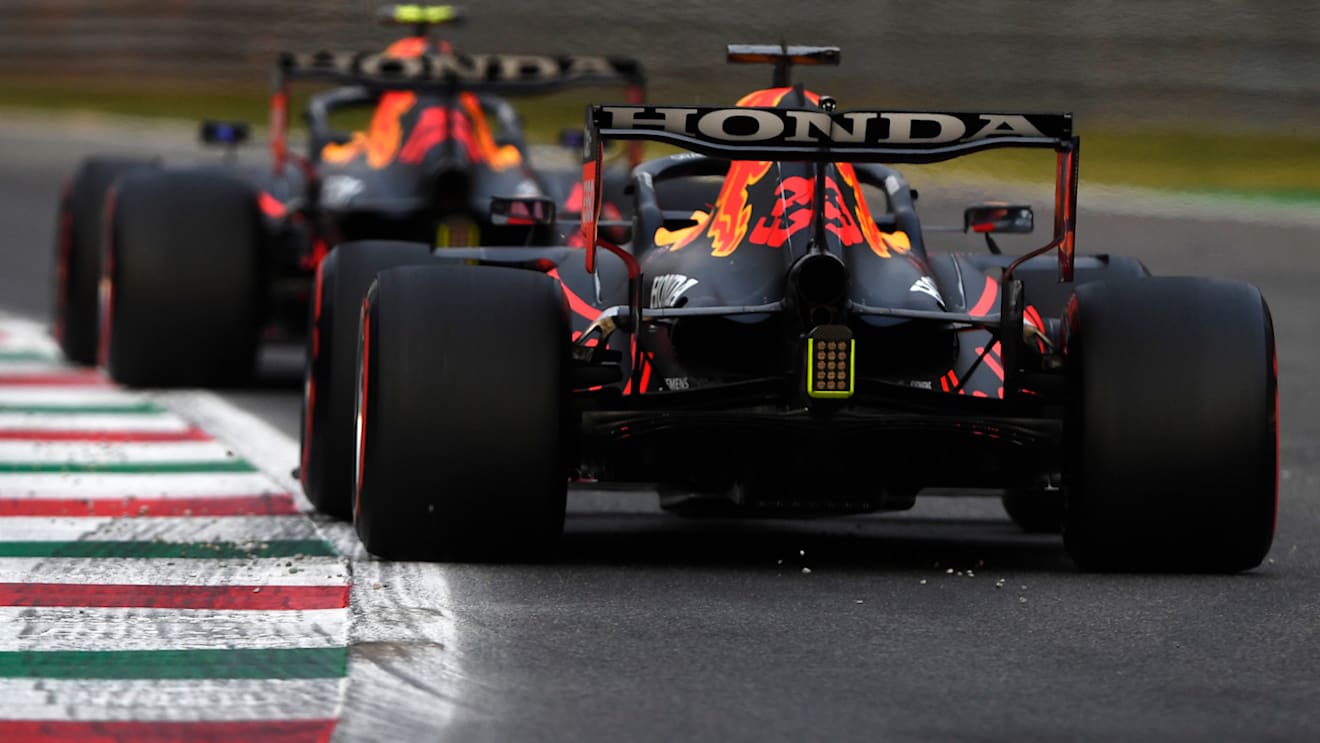 MONZA, ITALY - SEPTEMBER 10: Max Verstappen of the Netherlands driving the (33) Red Bull Racing RB16B Honda and Sergio Perez of Mexico driving the (11) Red Bull Racing RB16B Honda during qualifying ahead of the F1 Grand Prix of Italy at Autodromo di Monza on September 10, 2021 in Monza, Italy. (Photo by Rudy Carezzevoli/Getty Images)