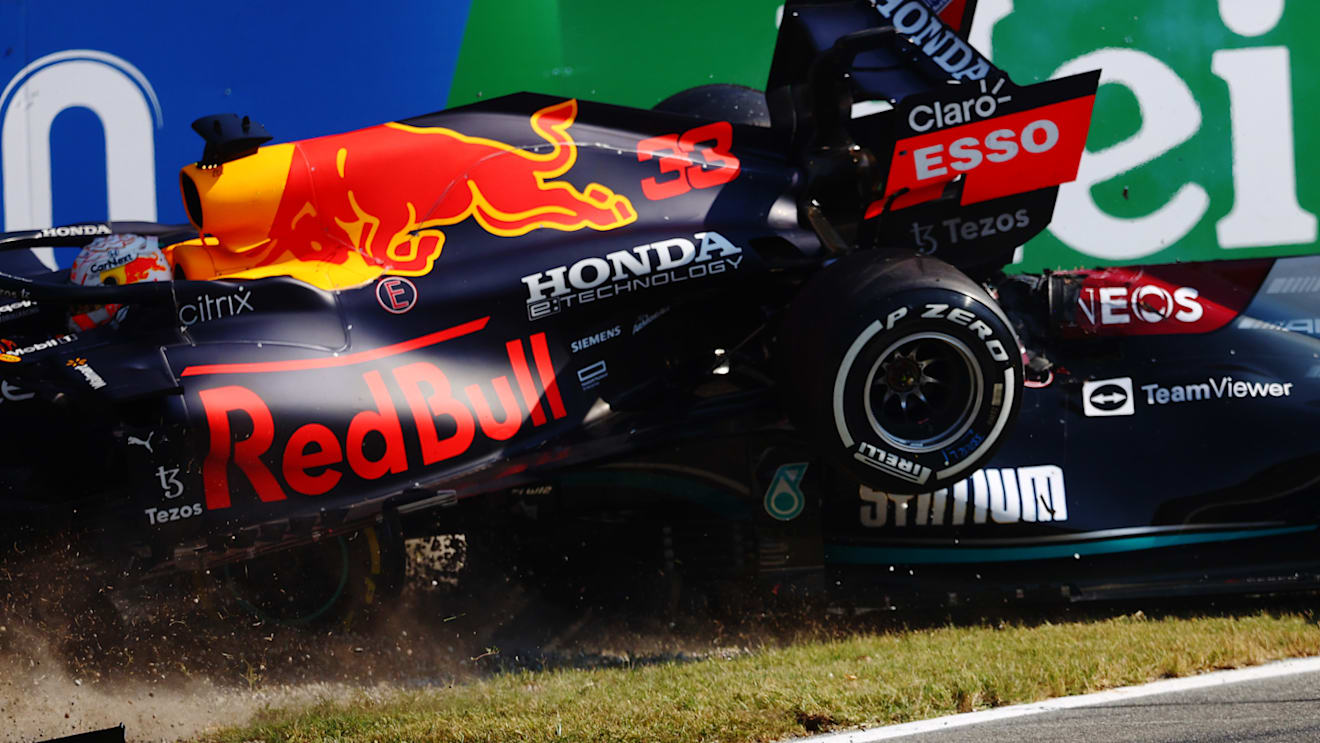 MONZA, ITALY - SEPTEMBER 12: Max Verstappen of the Netherlands driving the (33) Red Bull Racing RB16B Honda and Lewis Hamilton of Great Britain driving the (44) Mercedes AMG Petronas F1 Team Mercedes W12 crash during the F1 Grand Prix of Italy at Autodromo di Monza on September 12, 2021 in Monza, Italy. (Photo by Dan Istitene - Formula 1/Formula 1 via Getty Images)