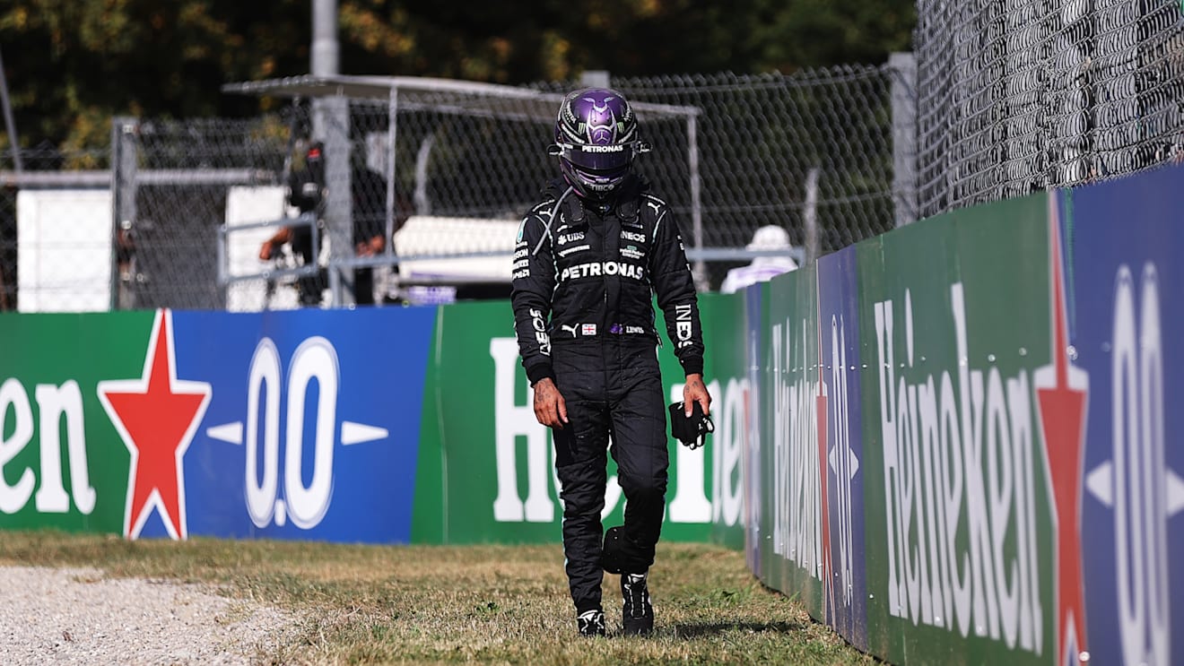 MONZA, ITALY - SEPTEMBER 12: Lewis Hamilton of Great Britain and Mercedes GP walks back to the pits after crashing during the F1 Grand Prix of Italy at Autodromo di Monza on September 12, 2021 in Monza, Italy. (Photo by Lars Baron/Getty Images)