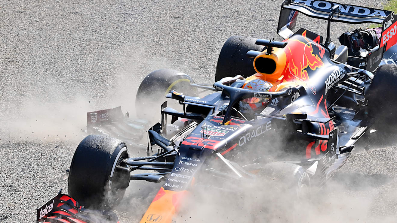 MONZA, ITALY - SEPTEMBER 12: Max Verstappen of the Netherlands driving the (33) Red Bull Racing RB16B Honda and Lewis Hamilton of Great Britain driving the (44) Mercedes AMG Petronas F1 Team Mercedes W12 crash during the F1 Grand Prix of Italy at Autodromo di Monza on September 12, 2021 in Monza, Italy. (Photo by Peter Van Egmond/Getty Images)