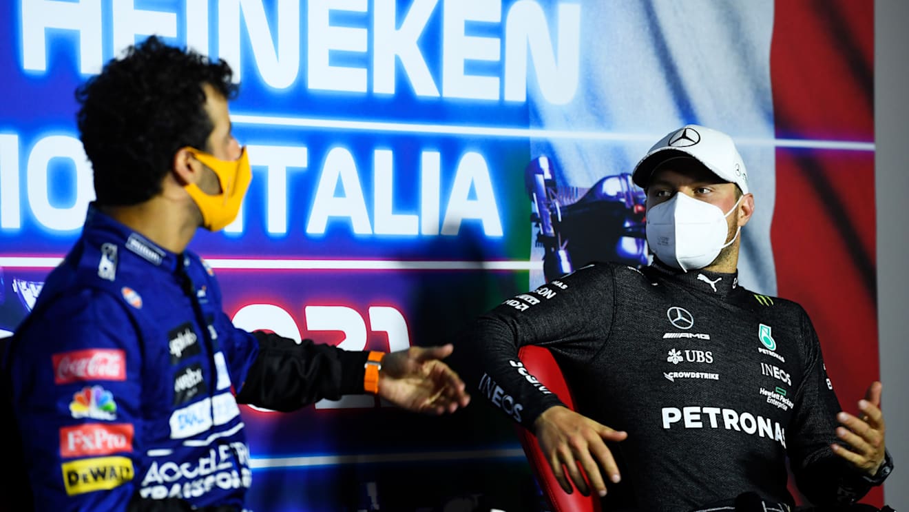 MONZA, ITALY - SEPTEMBER 12: Race winner Daniel Ricciardo of Australia and McLaren F1 and third placed Valtteri Bottas of Finland and Mercedes GP talk in the press conference after the F1 Grand Prix of Italy at Autodromo di Monza on September 12, 2021 in Monza, Italy. (Photo by Rudy Carezzevoli/Getty Images)
