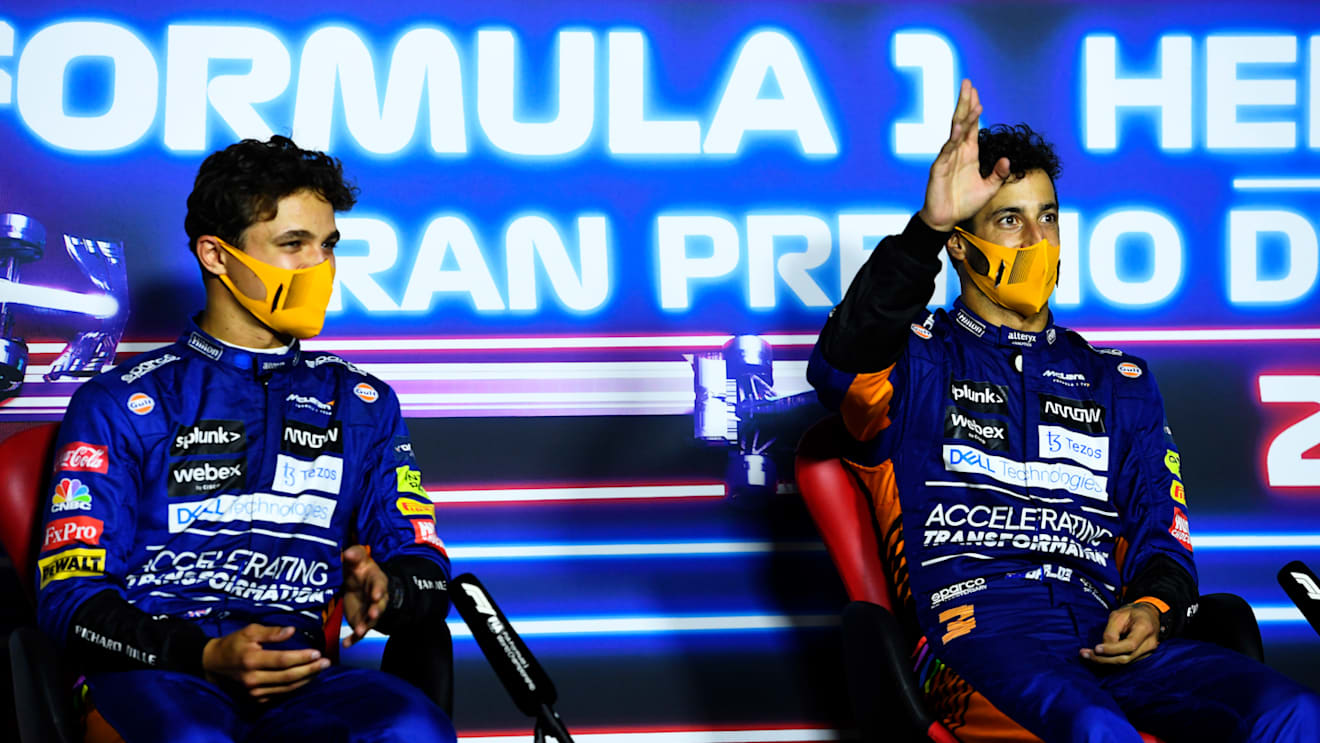 MONZA, ITALY - SEPTEMBER 12: Race winner Daniel Ricciardo of Australia and McLaren F1 and second placed Lando Norris of Great Britain and McLaren F1 talk in the press conference after the F1 Grand Prix of Italy at Autodromo di Monza on September 12, 2021 in Monza, Italy. (Photo by Rudy Carezzevoli/Getty Images)