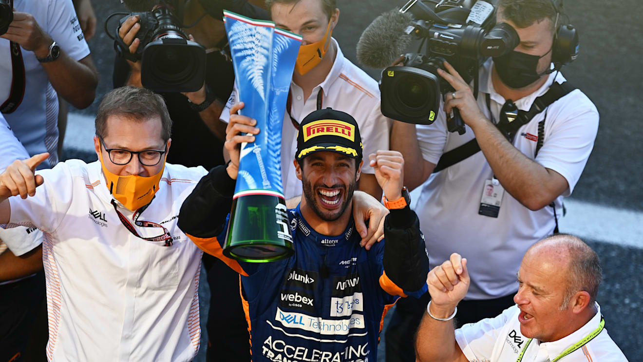 MONZA, ITALY - SEPTEMBER 12: Race winner Daniel Ricciardo of Australia and McLaren F1 celebrates with his team after the F1 Grand Prix of Italy at Autodromo di Monza on September 12, 2021 in Monza, Italy. (Photo by Clive Mason - Formula 1/Formula 1 via Getty Images)