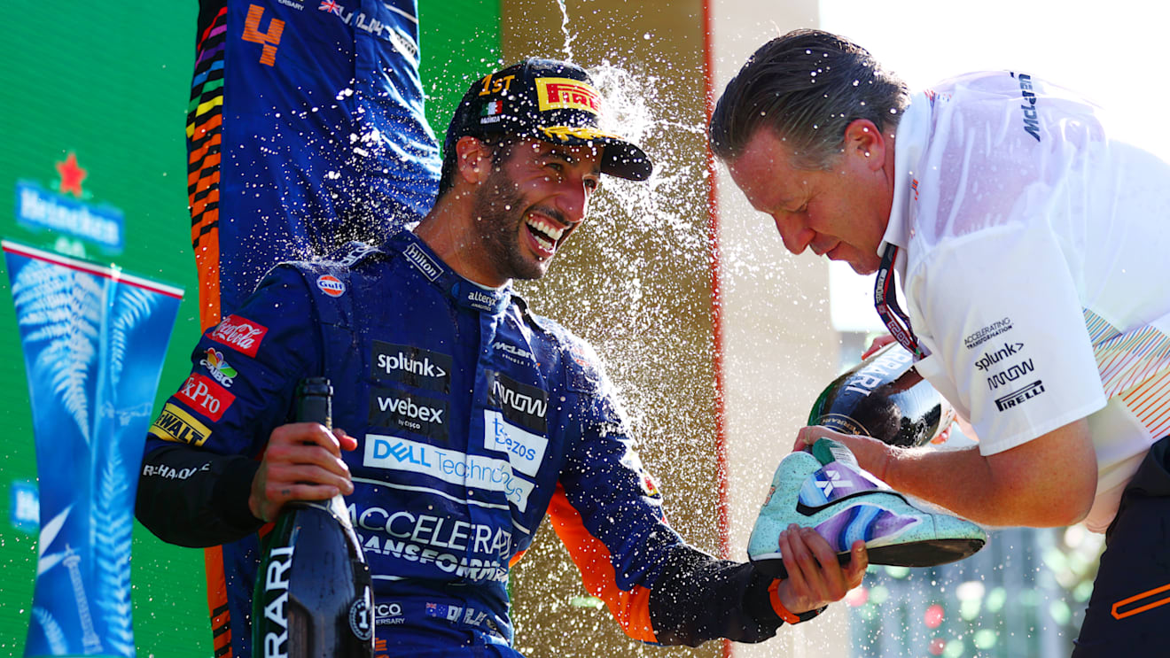 MONZA, ITALY - SEPTEMBER 12: Race winner Daniel Ricciardo of Australia and McLaren F1 and McLaren Chief Executive Officer Zak Brown celebrate on the podium during the F1 Grand Prix of Italy at Autodromo di Monza on September 12, 2021 in Monza, Italy. (Photo by Dan Istitene - Formula 1/Formula 1 via Getty Images)