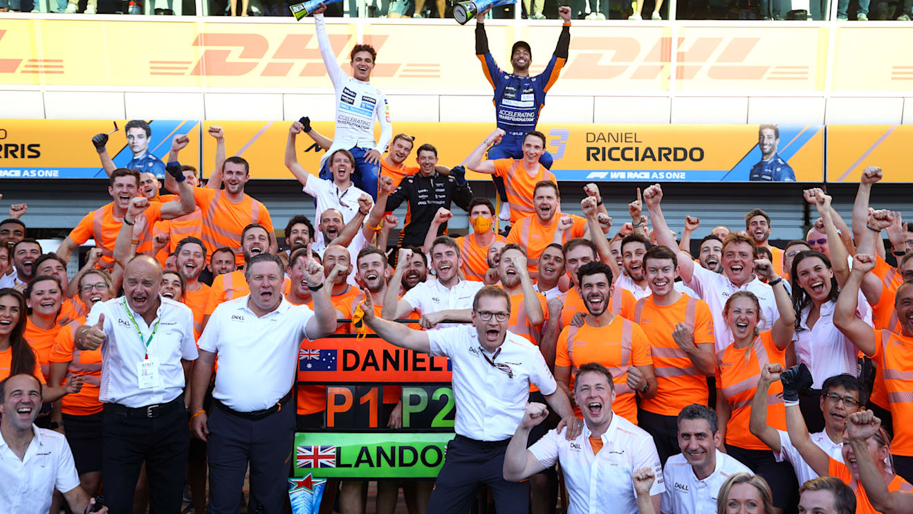 MONZA, ITALY - SEPTEMBER 12: Race winner Daniel Ricciardo of Australia and McLaren F1 and second placed Lando Norris of Great Britain and McLaren F1 celebrate with their team after the F1 Grand Prix of Italy at Autodromo di Monza on September 12, 2021 in Monza, Italy. (Photo by Bryn Lennon/Getty Images)
