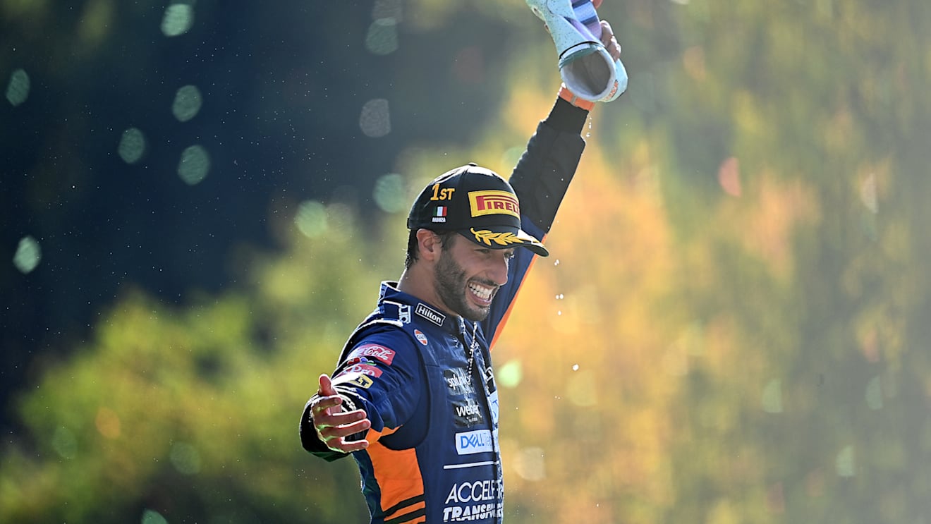 MONZA, ITALY - SEPTEMBER 12: Race winner Daniel Ricciardo of Australia and McLaren F1 celebrates on the podium during the F1 Grand Prix of Italy at Autodromo di Monza on September 12, 2021 in Monza, Italy. (Photo by Clive Mason - Formula 1/Formula 1 via Getty Images)