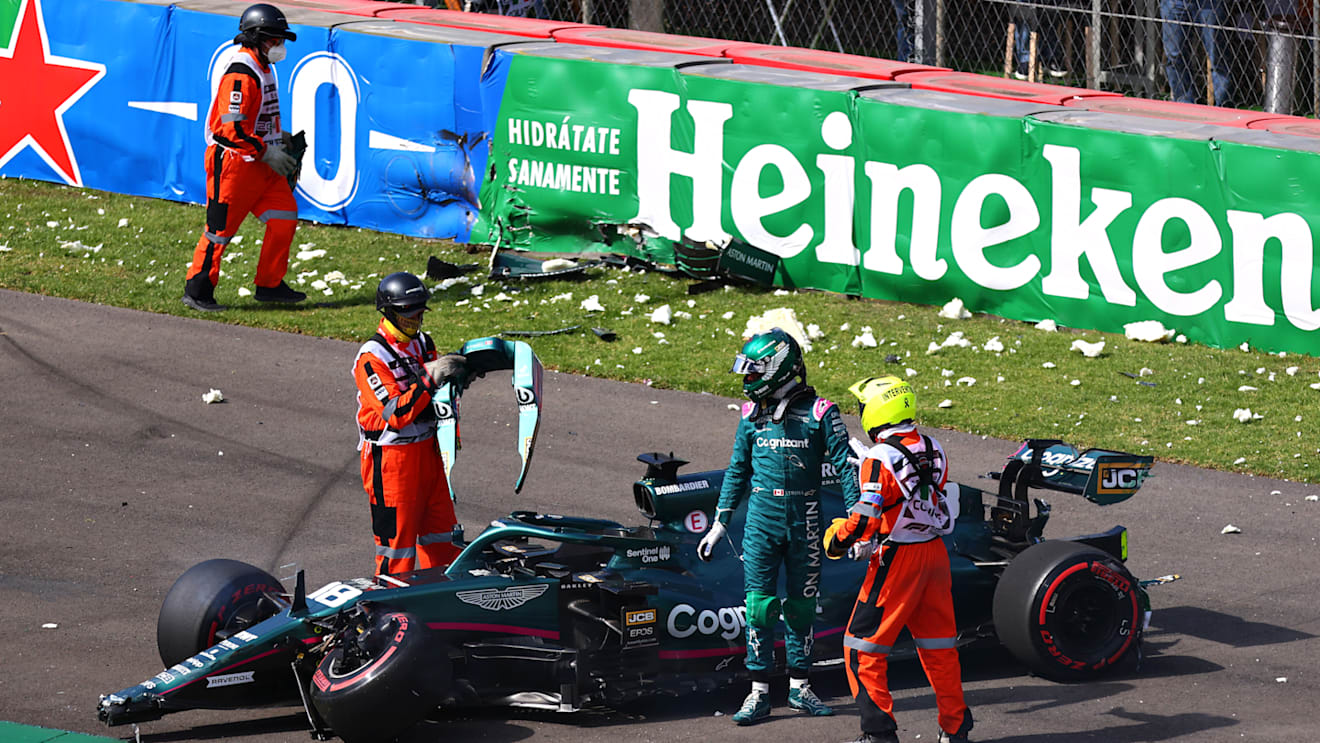 MEXICO CITY, MEXICO - NOVEMBER 06: Lance Stroll of Canada driving the (18) Aston Martin AMR21 Mercedes looks over his car after crashing during qualifying ahead of the F1 Grand Prix of Mexico at Autodromo Hermanos Rodriguez on November 06, 2021 in Mexico City, Mexico. (Photo by Hector Vivas - Formula 1/Formula 1 via Getty Images)