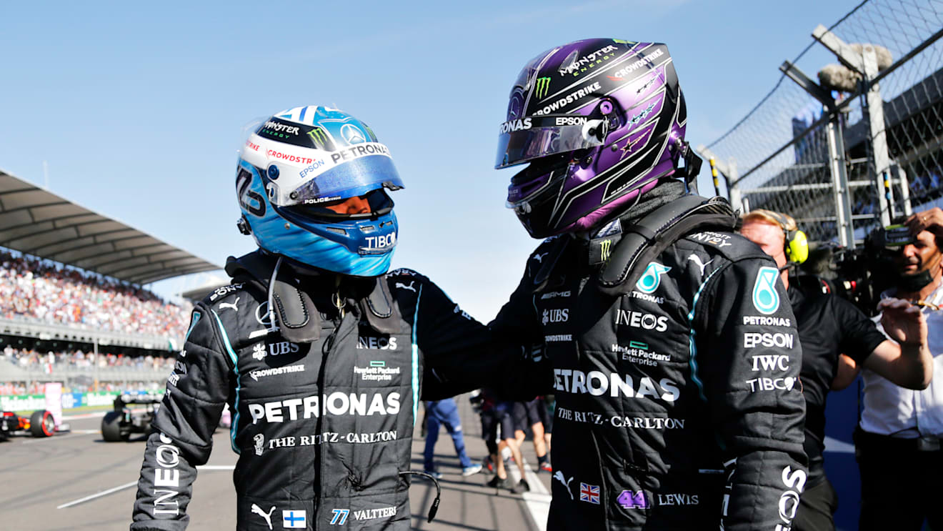 MEXICO CITY, MEXICO - NOVEMBER 06: Pole position qualifier Valtteri Bottas of Finland and Mercedes GP and second place qualifier Lewis Hamilton of Great Britain and Mercedes GP celebrate in parc ferme during qualifying ahead of the F1 Grand Prix of Mexico at Autodromo Hermanos Rodriguez on November 06, 2021 in Mexico City, Mexico. (Photo by Francisco Guasco - Pool/Getty Images)