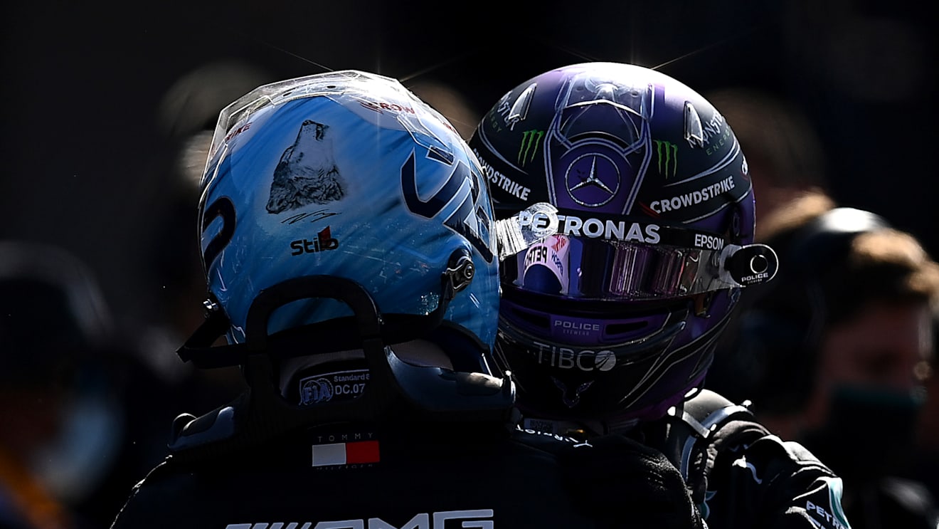 MEXICO CITY, MEXICO - NOVEMBER 06: Pole position qualifier Valtteri Bottas of Finland and Mercedes GP and second place qualifier Lewis Hamilton of Great Britain and Mercedes GP celebrate in parc ferme during qualifying ahead of the F1 Grand Prix of Mexico at Autodromo Hermanos Rodriguez on November 06, 2021 in Mexico City, Mexico. (Photo by Clive Mason/Getty Images)