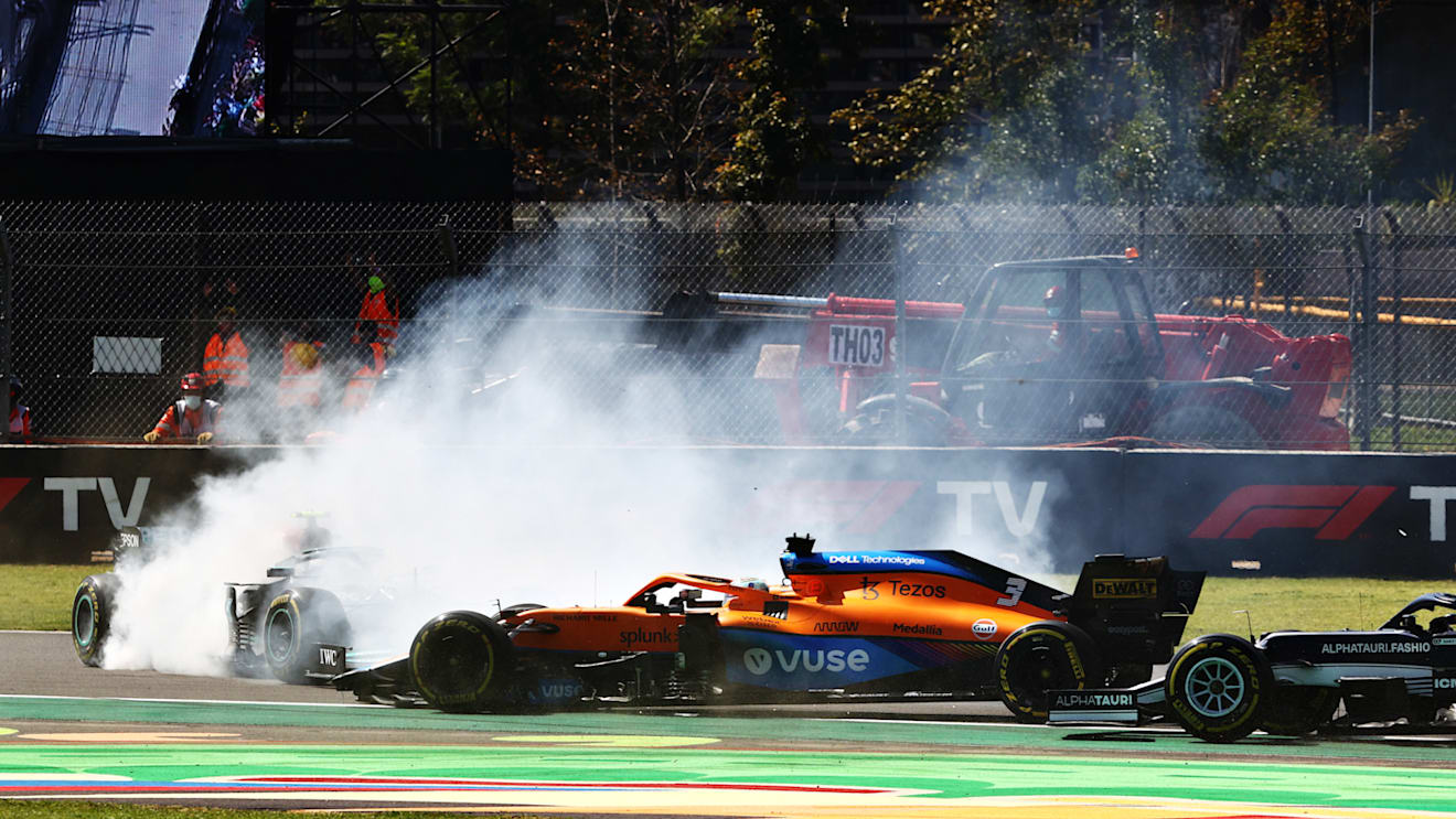 MEXICO CITY, MEXICO - NOVEMBER 07: Daniel Ricciardo of Australia driving the (3) McLaren F1 Team MCL35M Mercedes passes Valtteri Bottas of Finland driving the (77) Mercedes AMG Petronas F1 Team Mercedes W12 after he span at the start during the F1 Grand Prix of Mexico at Autodromo Hermanos Rodriguez on November 07, 2021 in Mexico City, Mexico. (Photo by Mark Thompson/Getty Images)