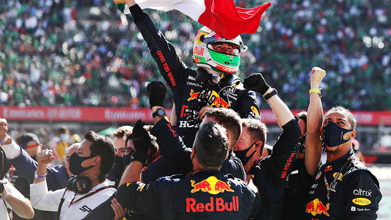 MEXICO CITY, MEXICO - NOVEMBER 07: Third placed Sergio Perez of Mexico and Red Bull Racing celebrates in parc ferme during the F1 Grand Prix of Mexico at Autodromo Hermanos Rodriguez on November 07, 2021 in Mexico City, Mexico. (Photo by Lars Baron/Getty Images)