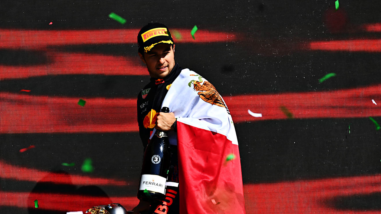 MEXICO CITY, MEXICO - NOVEMBER 07: Third placed Sergio Perez of Mexico and Red Bull Racing celebrates on the podium during the F1 Grand Prix of Mexico at Autodromo Hermanos Rodriguez on November 07, 2021 in Mexico City, Mexico. (Photo by Clive Mason/Getty Images)