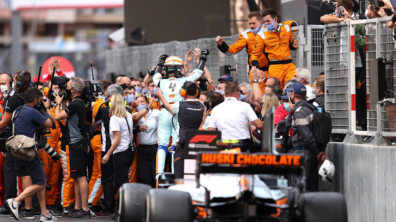 MONTE-CARLO, MONACO - MAY 23: Third placed Lando Norris of Great Britain and McLaren F1 celebrates with his team in parc ferme during the F1 Grand Prix of Monaco at Circuit de Monaco on May 23, 2021 in Monte-Carlo, Monaco. (Photo by Lars Baron/Getty Images)