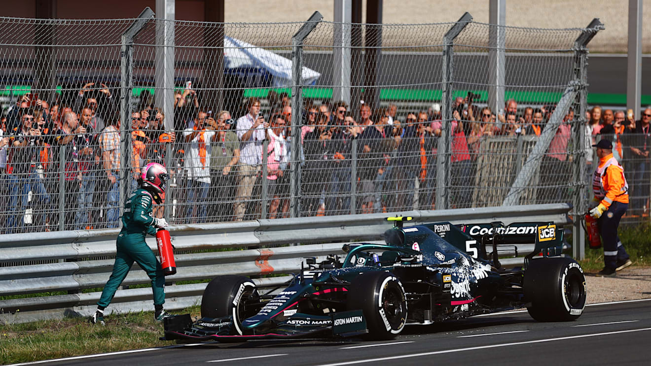 ZANDVOORT, NETHERLANDS - SEPTEMBER 03: Sebastian Vettel of Germany and Aston Martin F1 Team attempts to put out his engine fire with a fire extinguisher during practice ahead of the F1 Grand Prix of The Netherlands at Circuit Zandvoort on September 03, 2021 in Zandvoort, Netherlands. (Photo by Dan Istitene - Formula 1/Formula 1 via Getty Images)