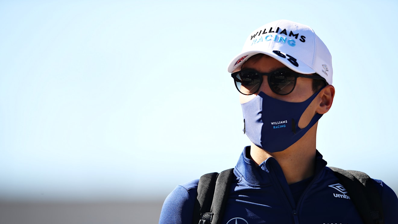 PORTIMAO, PORTUGAL - APRIL 30: George Russell of Great Britain and Williams walks in the Paddock before practice ahead of the F1 Grand Prix of Portugal at Autodromo Internacional Do Algarve on April 30, 2021 in Portimao, Portugal. (Photo by Mark Thompson/Getty Images)