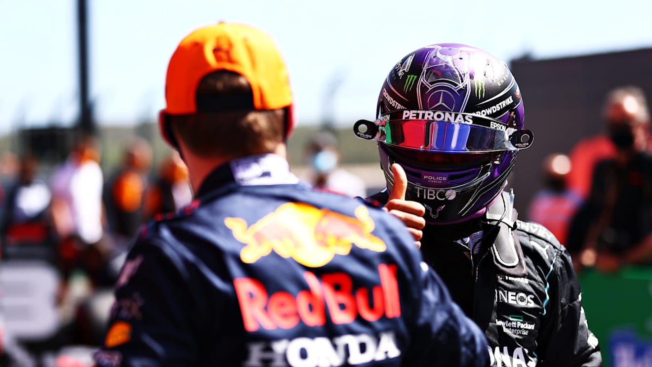 PORTIMAO, PORTUGAL - MAY 01: Second place qualifier Lewis Hamilton of Great Britain and Mercedes GP shakes hands with third place qualifier Max Verstappen of Netherlands and Red Bull Racing in parc ferme during qualifying for the F1 Grand Prix of Portugal at Autodromo Internacional Do Algarve on May 01, 2021 in Portimao, Portugal. (Photo by Dan Istitene - Formula 1/Formula 1 via Getty Images)