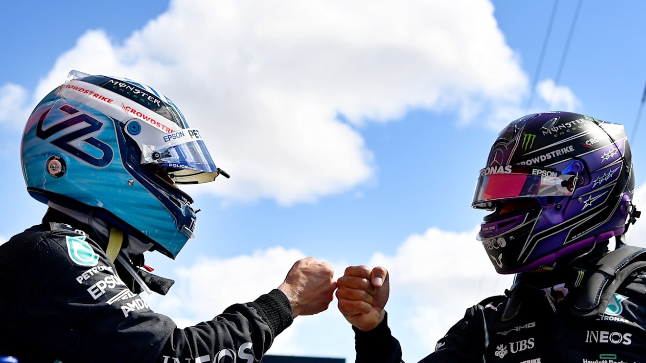 PORTIMAO, PORTUGAL - MAY 01: Pole position qualifier Valtteri Bottas of Finland and Mercedes GP interacts with teammate and second placed qualifier Lewis Hamilton of Great Britain and Mercedes GP in parc ferme after qualifying for the F1 Grand Prix of Portugal at Autodromo Internacional Do Algarve on May 01, 2021 in Portimao, Portugal. (Photo by Gabriel Bouys - Pool/Getty Images)