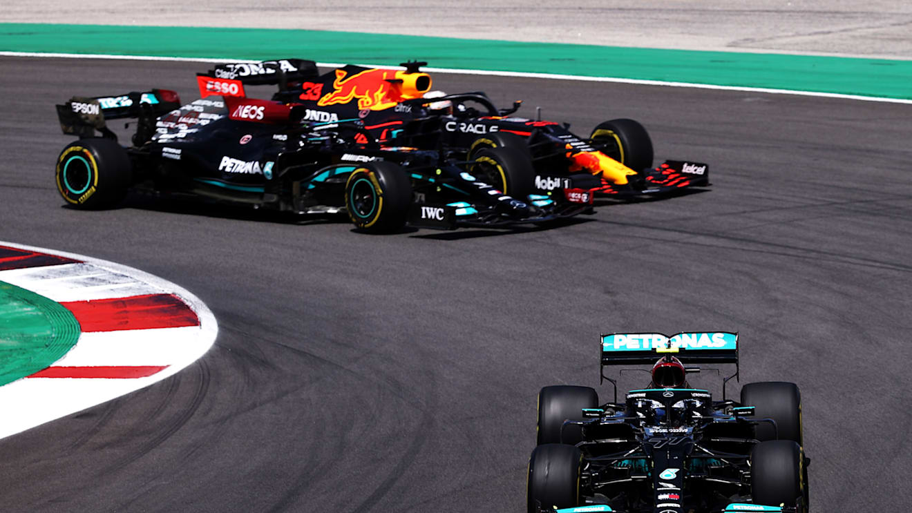 PORTIMAO, PORTUGAL - MAY 02: Valtteri Bottas of Finland driving the (77) Mercedes AMG Petronas F1 Team Mercedes W12 leads Lewis Hamilton of Great Britain driving the (44) Mercedes AMG Petronas F1 Team Mercedes W12 and Max Verstappen of the Netherlands driving the (33) Red Bull Racing RB16B Honda on track during the F1 Grand Prix of Portugal at Autodromo Internacional Do Algarve on May 02, 2021 in Portimao, Portugal. (Photo by Lars Baron/Getty Images)