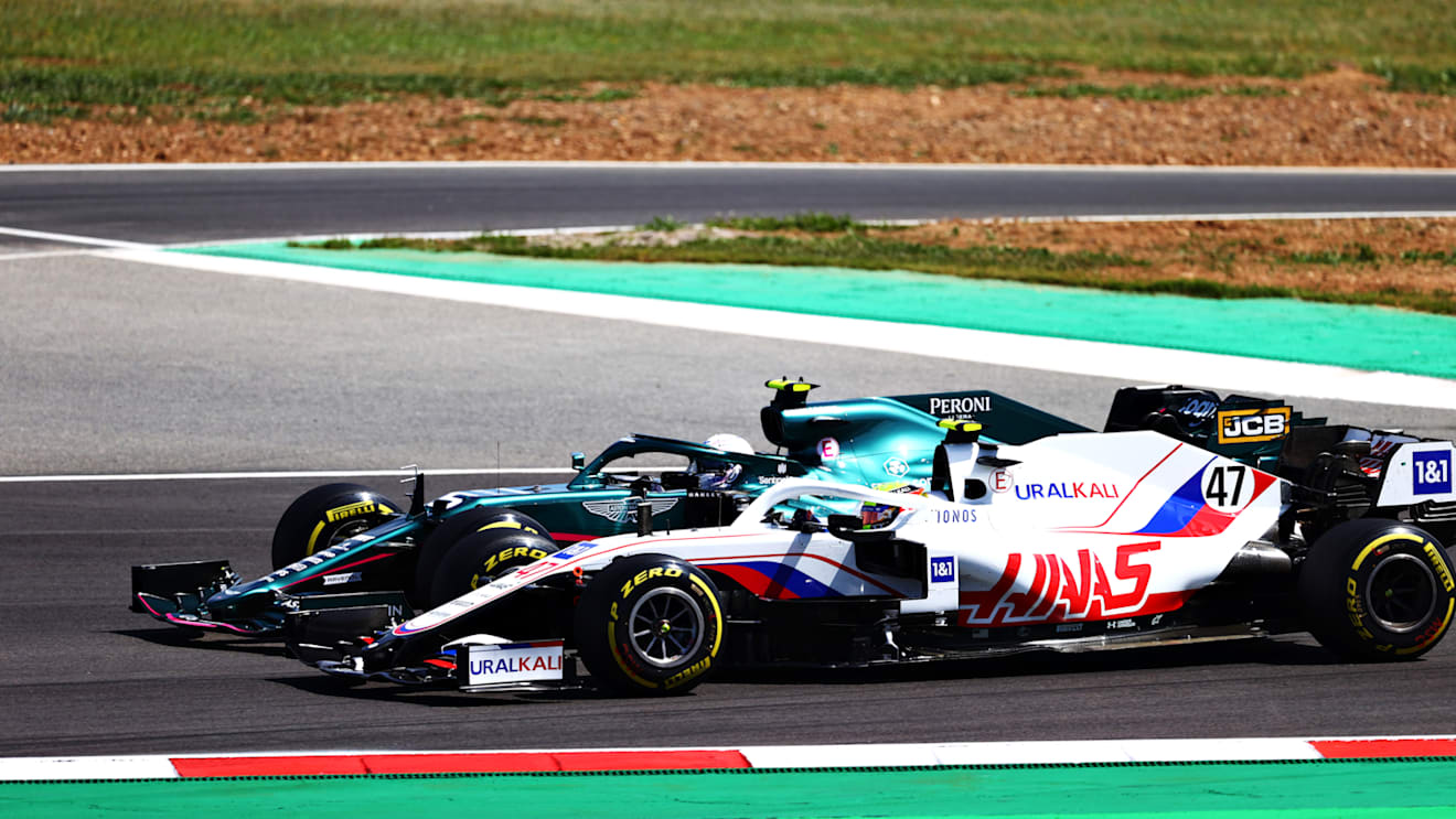 PORTIMAO, PORTUGAL - MAY 02: Sebastian Vettel of Germany driving the (5) Aston Martin AMR21 Mercedes and Mick Schumacher of Germany driving the (47) Haas F1 Team VF-21 Ferrari battle for position during the F1 Grand Prix of Portugal at Autodromo Internacional Do Algarve on May 02, 2021 in Portimao, Portugal. (Photo by Dan Istitene - Formula 1/Formula 1 via Getty Images)