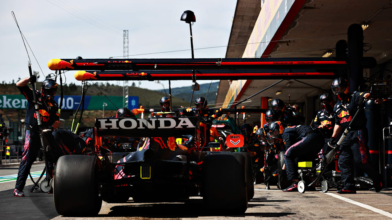 PORTIMAO, PORTUGAL - MAY 02: Sergio Perez of Mexico driving the (11) Red Bull Racing RB16B Honda makes a pitstop during the F1 Grand Prix of Portugal at Autodromo Internacional Do Algarve on May 02, 2021 in Portimao, Portugal. (Photo by Mark Thompson/Getty Images)