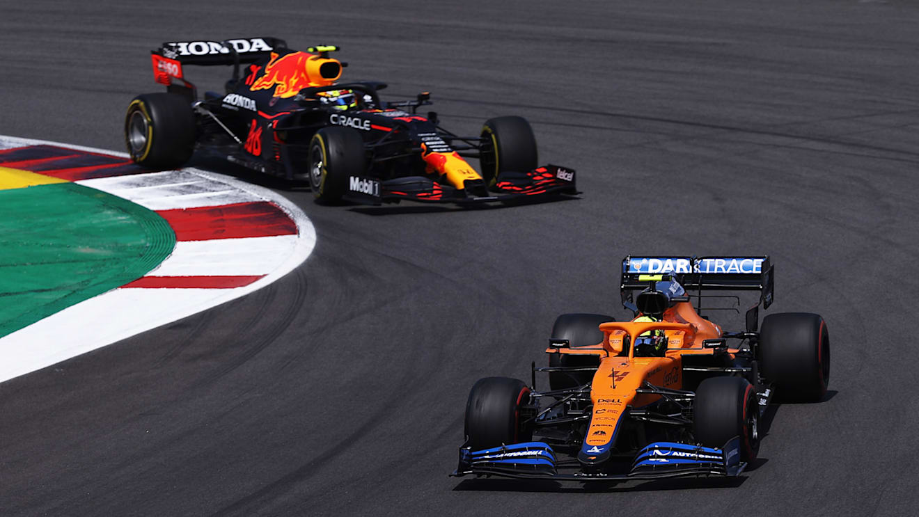 PORTIMAO, PORTUGAL - MAY 02: Lando Norris of Great Britain driving the (4) McLaren F1 Team MCL35M Mercedes leads Sergio Perez of Mexico driving the (11) Red Bull Racing RB16B Honda on track during the F1 Grand Prix of Portugal at Autodromo Internacional Do Algarve on May 02, 2021 in Portimao, Portugal. (Photo by Lars Baron/Getty Images)