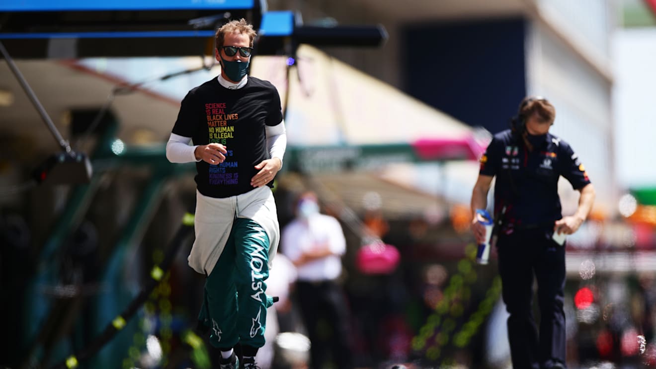PORTIMAO, PORTUGAL - MAY 02: Sebastian Vettel of Germany and Aston Martin F1 Team runs to the grid during the F1 Grand Prix of Portugal at Autodromo Internacional Do Algarve on May 02, 2021 in Portimao, Portugal. (Photo by Peter Fox/Getty Images)