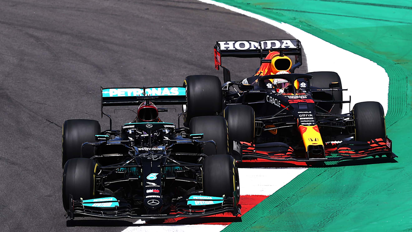 PORTIMAO, PORTUGAL - MAY 02: Lewis Hamilton of Great Britain driving the (44) Mercedes AMG Petronas F1 Team Mercedes W12 leads Max Verstappen of the Netherlands driving the (33) Red Bull Racing RB16B Honda on track during the F1 Grand Prix of Portugal at Autodromo Internacional Do Algarve on May 02, 2021 in Portimao, Portugal. (Photo by Lars Baron/Getty Images)
