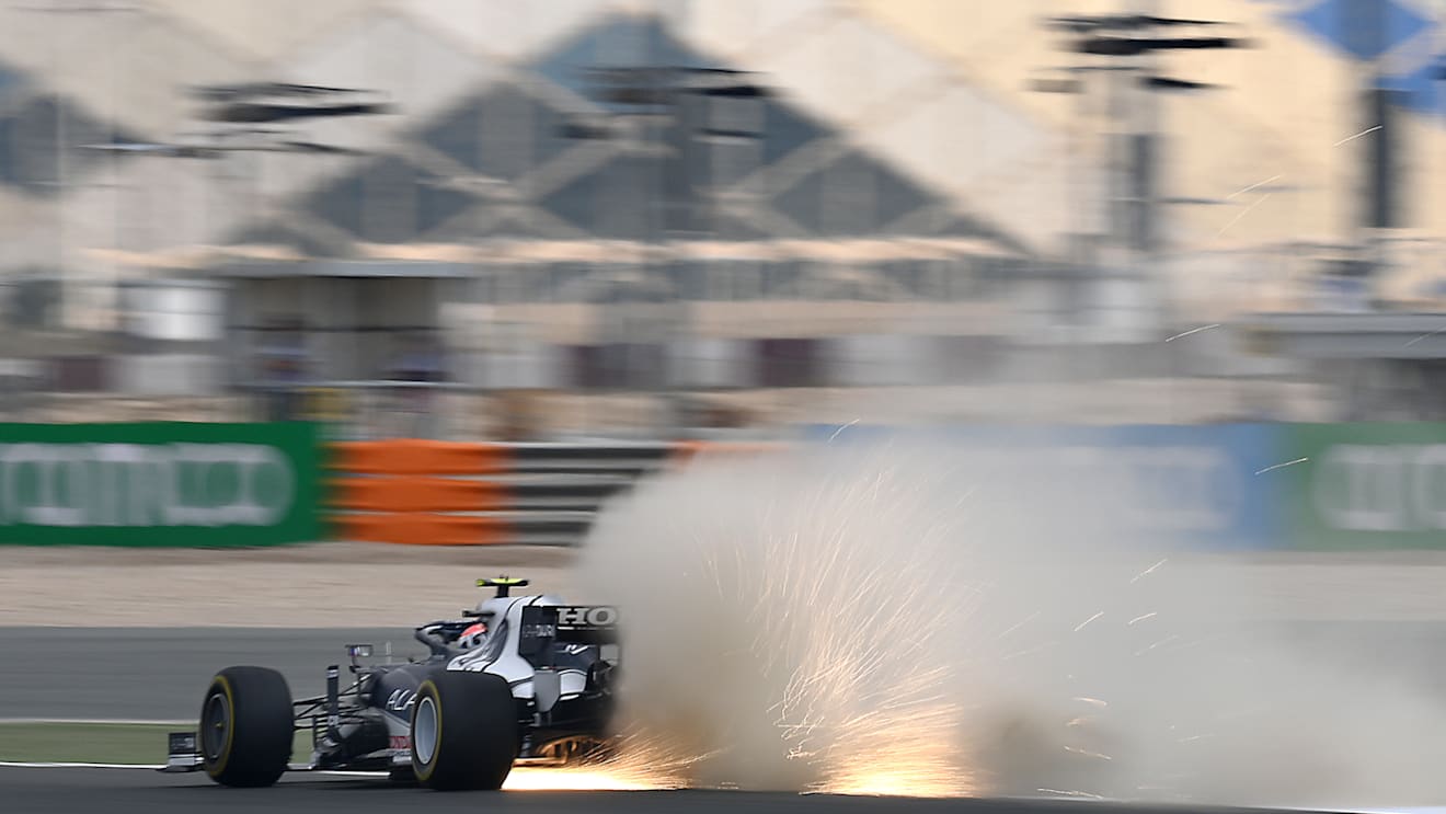 DOHA, QATAR - NOVEMBER 19: Sparks fly behind Pierre Gasly of France driving the (10) Scuderia AlphaTauri AT02 Honda during practice ahead of the F1 Grand Prix of Qatar at Losail International Circuit on November 19, 2021 in Doha, Qatar. (Photo by Clive Mason/Getty Images)