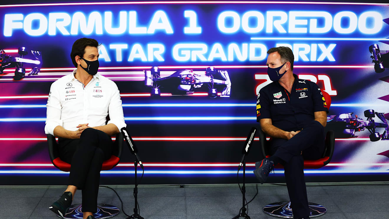 DOHA, QATAR - NOVEMBER 19: Mercedes GP Executive Director Toto Wolff and Red Bull Racing Team Principal Christian Horner talk in the Team Principals Press Conference during practice ahead of the F1 Grand Prix of Qatar at Losail International Circuit on November 19, 2021 in Doha, Qatar. (Photo by Dan Istitene/Getty Images)
