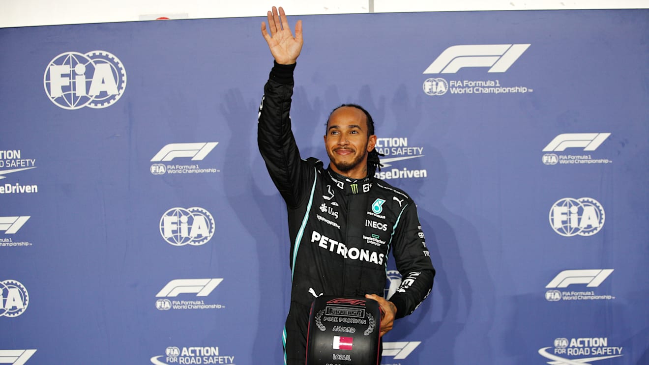 DOHA, QATAR - NOVEMBER 20: Pole position qualifier Lewis Hamilton of Great Britain and Mercedes GP waves to the crowd in parc ferme during qualifying ahead of the F1 Grand Prix of Qatar at Losail International Circuit on November 20, 2021 in Doha, Qatar. (Photo by Hamad I Mohammed - Pool/Getty Images)