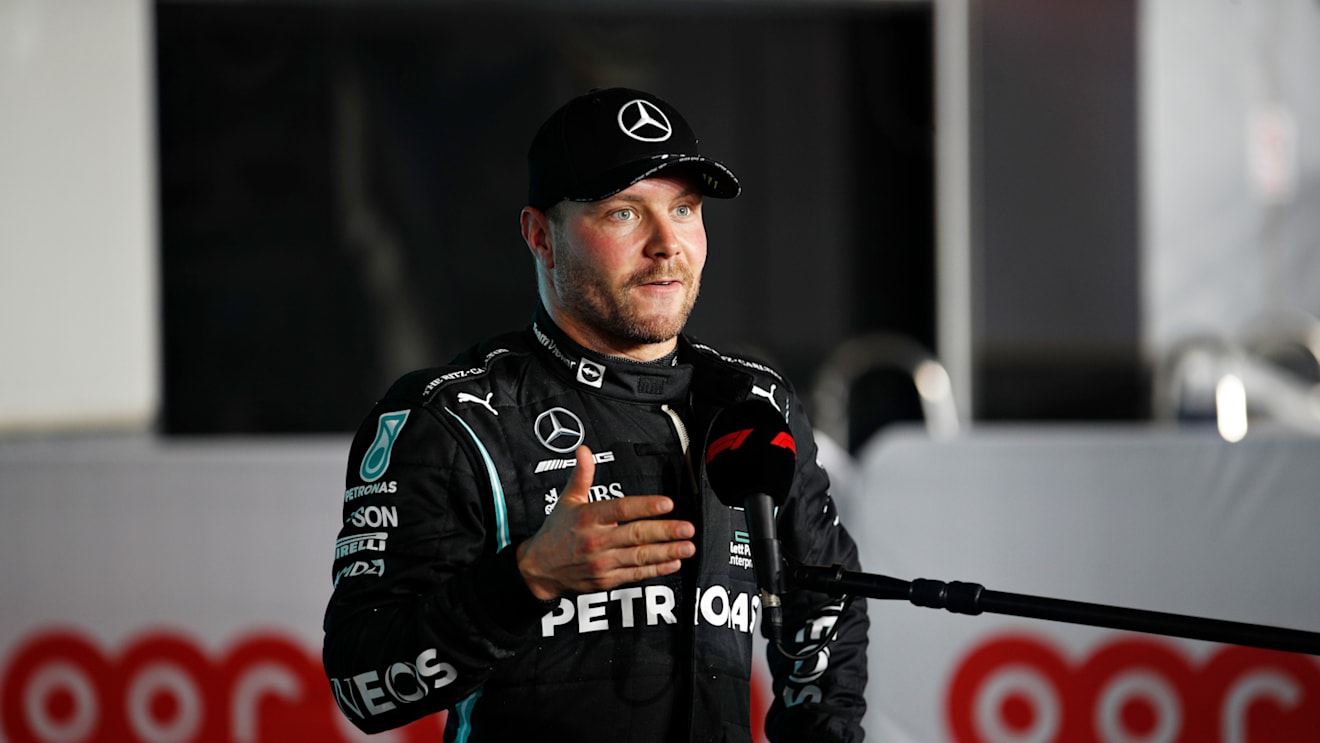 DOHA, QATAR - NOVEMBER 20: Third place qualifier Valtteri Bottas of Finland and Mercedes GP talks to the media in parc ferme during qualifying ahead of the F1 Grand Prix of Qatar at Losail International Circuit on November 20, 2021 in Doha, Qatar. (Photo by Hamad I Mohammed - Pool/Getty Images)