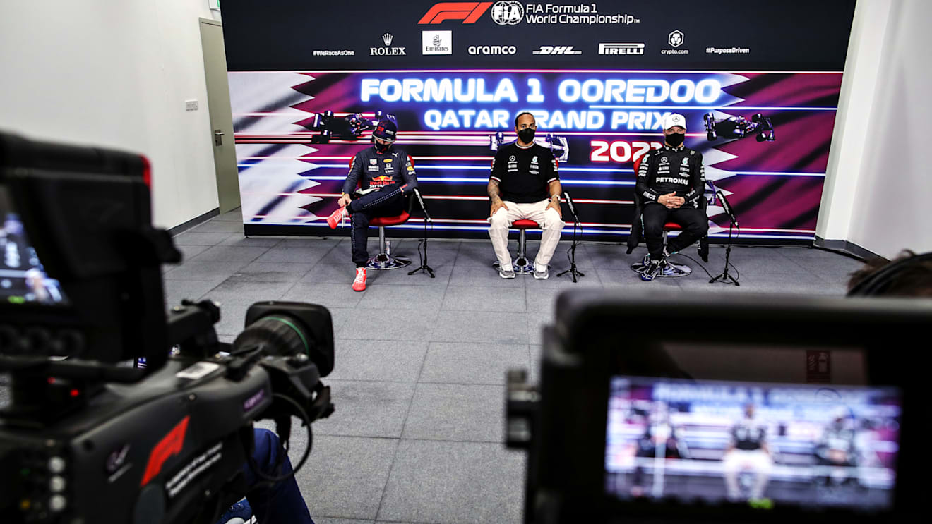 DOHA, QATAR - NOVEMBER 20: Pole position qualifier Lewis Hamilton of Great Britain and Mercedes GP, second placed qualifier Max Verstappen of Netherlands and Red Bull Racing and third placed qualifier Valtteri Bottas of Finland and Mercedes GP talk in a press conference after qualifying ahead of the F1 Grand Prix of Qatar at Losail International Circuit on November 20, 2021 in Doha, Qatar. (Photo by Florent Gooden - Pool/Getty Images)
