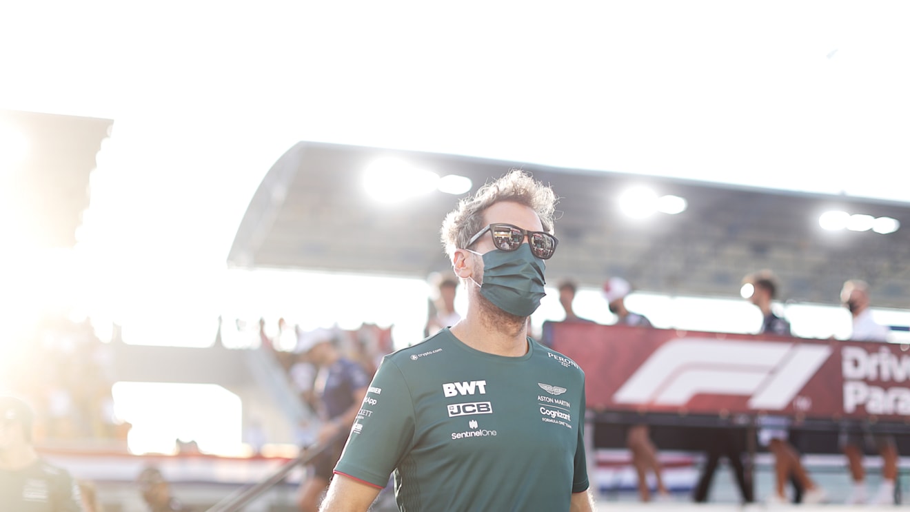 DOHA, QATAR - NOVEMBER 21: Sebastian Vettel of Germany driving the (5) Aston Martin AMR21 Mercedes on his way to the grid before the F1 Grand Prix of Qatar at Losail International Circuit on November 21, 2021 in Doha, Qatar. (Photo by Clive Mason/Getty Images)