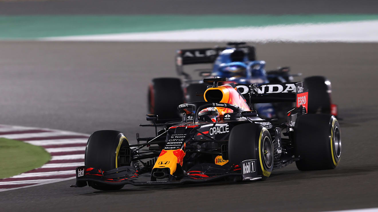 DOHA, QATAR - NOVEMBER 21: Max Verstappen of the Netherlands driving the (33) Red Bull Racing RB16B Honda leads Fernando Alonso of Spain driving the (14) Alpine A521 Renault during the F1 Grand Prix of Qatar at Losail International Circuit on November 21, 2021 in Doha, Qatar. (Photo by Lars Baron/Getty Images)