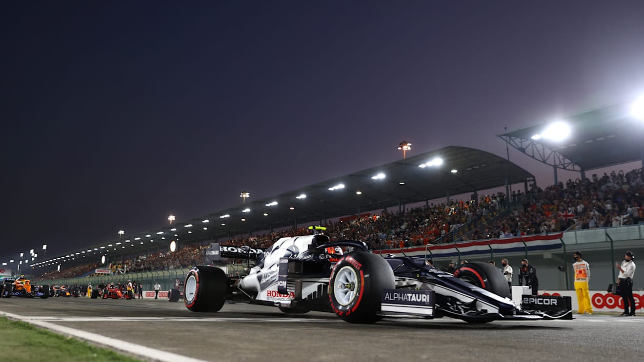 DOHA, QATAR - NOVEMBER 21: Pierre Gasly of France driving the (10) Scuderia AlphaTauri AT02 Honda on the formation lap before the F1 Grand Prix of Qatar at Losail International Circuit on November 21, 2021 in Doha, Qatar. (Photo by Dan Istitene - Formula 1/Formula 1 via Getty Images)