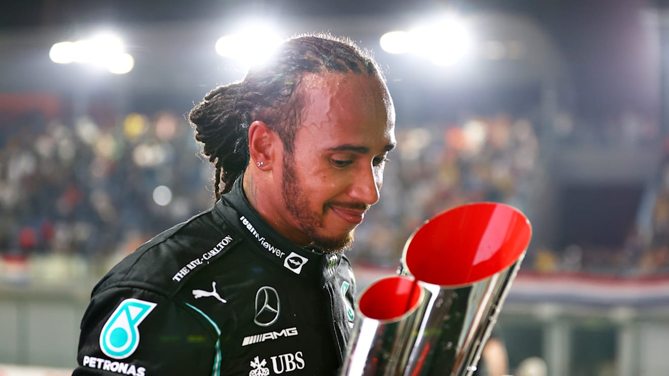 DOHA, QATAR - NOVEMBER 21: Race winner Lewis Hamilton of Great Britain and Mercedes GP celebrates on the podium during the F1 Grand Prix of Qatar at Losail International Circuit on November 21, 2021 in Doha, Qatar. (Photo by Dan Istitene - Formula 1/Formula 1 via Getty Images)