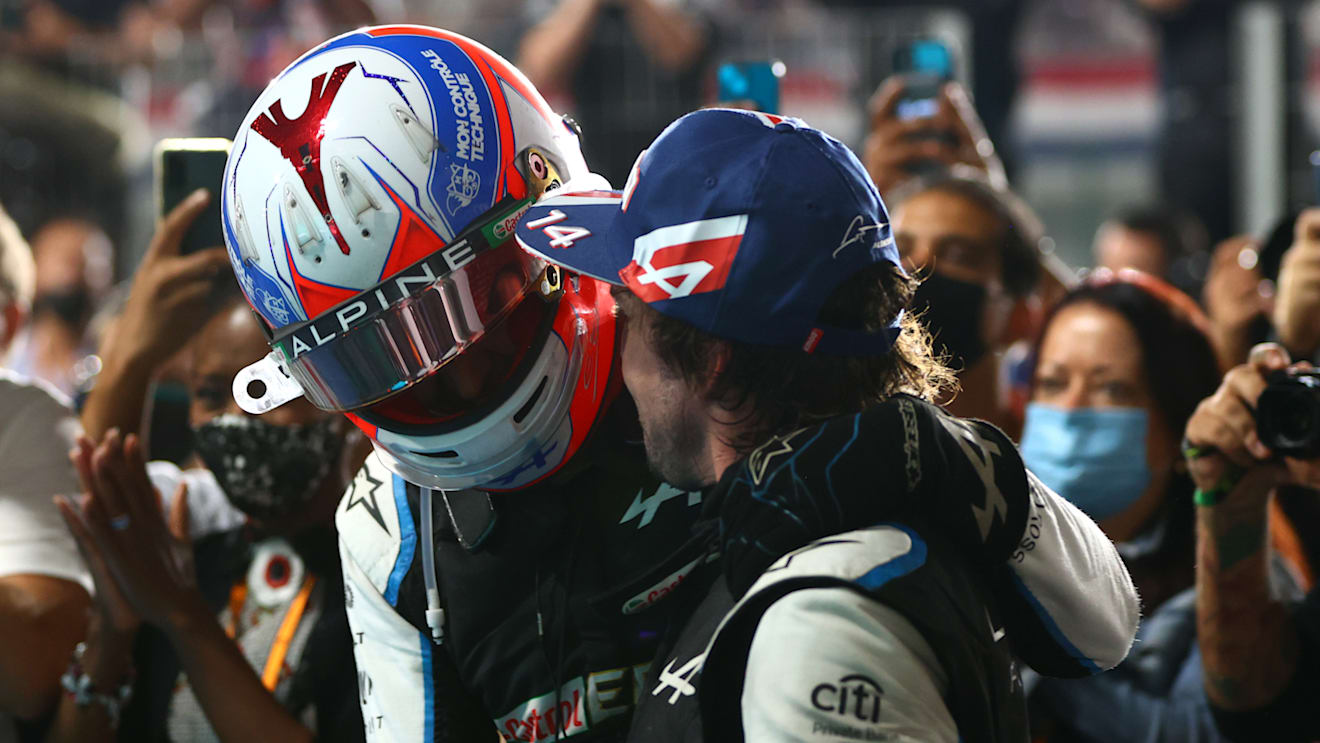 DOHA, QATAR - NOVEMBER 21: Third placed Fernando Alonso of Spain and Alpine F1 Team celebrates with teammate Esteban Ocon of France and Alpine F1 Team in parc ferme during the F1 Grand Prix of Qatar at Losail International Circuit on November 21, 2021 in Doha, Qatar. (Photo by Dan Istitene - Formula 1/Formula 1 via Getty Images)