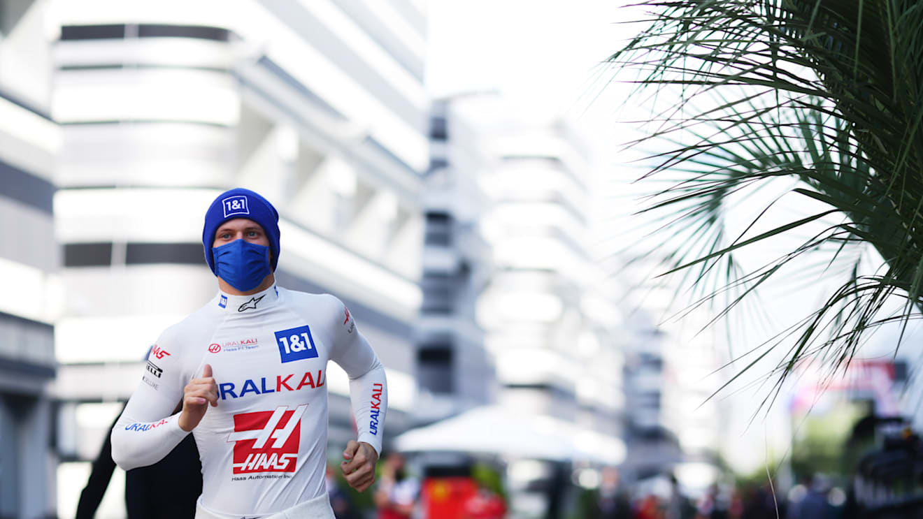 SOCHI, RUSSIA - SEPTEMBER 24: Mick Schumacher of Germany and Haas F1 runs in the Paddock before practice ahead of the F1 Grand Prix of Russia at Sochi Autodrom on September 24, 2021 in Sochi, Russia. (Photo by Peter Fox/Getty Images)