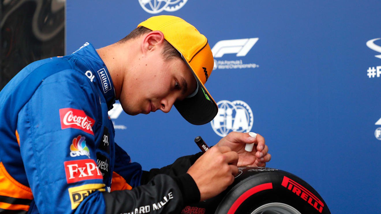 SOCHI, RUSSIA - SEPTEMBER 25: Pole position qualifier Lando Norris of Great Britain and McLaren F1 celebrates in parc ferme during qualifying ahead of the F1 Grand Prix of Russia at Sochi Autodrom on September 25, 2021 in Sochi, Russia. (Photo by Yuri Kochetkov - Pool/Getty Images)