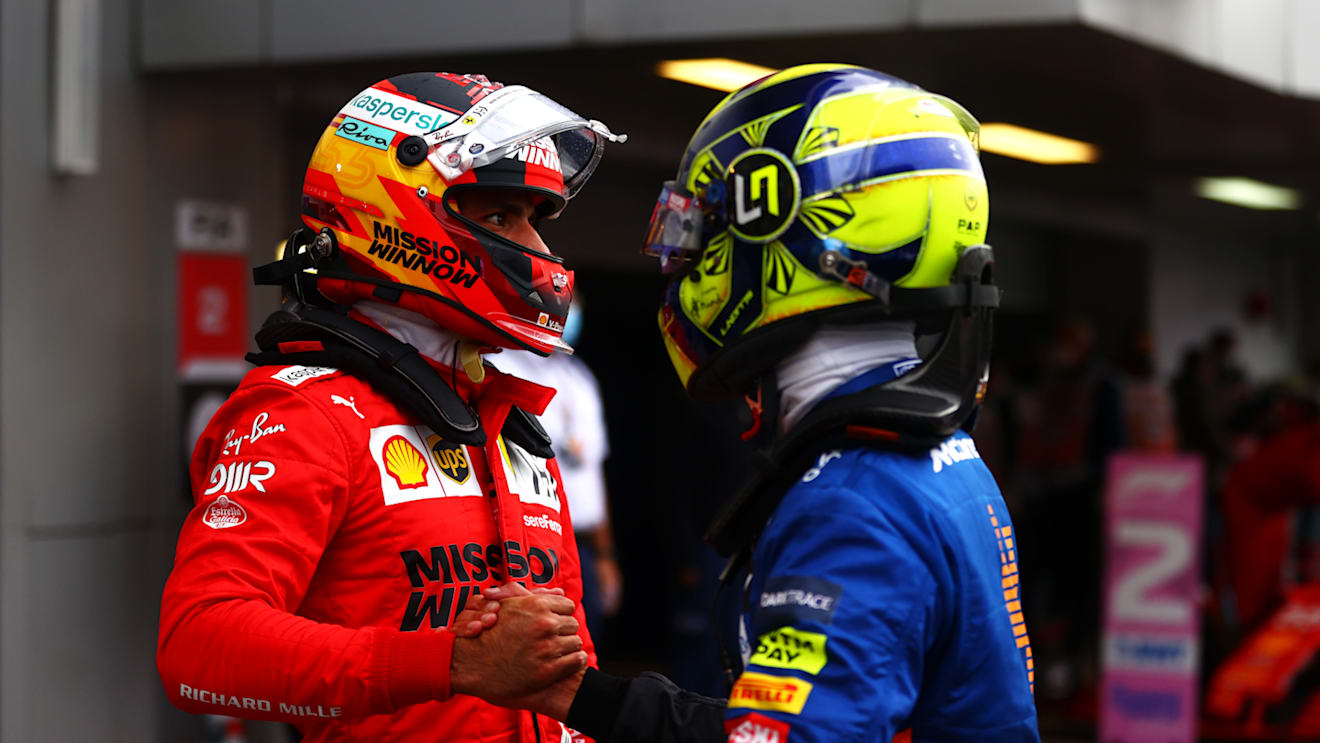 SOCHI, RUSSIA - SEPTEMBER 25: Pole position qualifier Lando Norris of Great Britain and McLaren F1 talks with second place qualifier Carlos Sainz of Spain and Ferrari in parc ferme during qualifying ahead of the F1 Grand Prix of Russia at Sochi Autodrom on September 25, 2021 in Sochi, Russia. (Photo by Dan Istitene - Formula 1/Formula 1 via Getty Images)