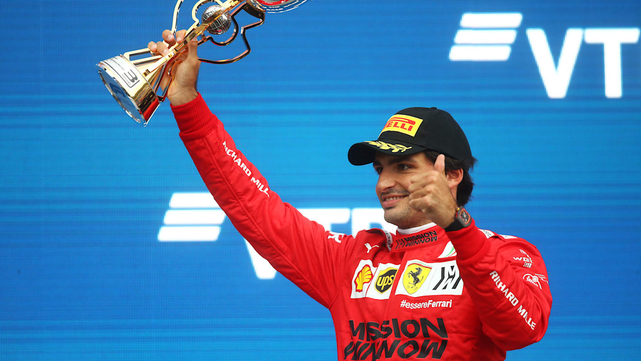 SOCHI, RUSSIA - SEPTEMBER 26: Third placed Carlos Sainz of Spain and Ferrari celebrates on the podium during the F1 Grand Prix of Russia at Sochi Autodrom on September 26, 2021 in Sochi, Russia. (Photo by Mark Thompson/Getty Images)