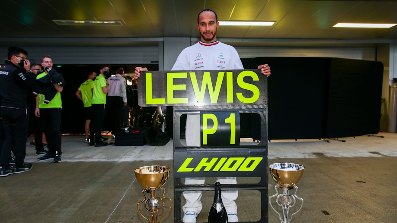 SOCHI, RUSSIA - SEPTEMBER 26: Lewis Hamilton of Mercedes and Great Britain celebrates winning his 100th Grand Prix during the F1 Grand Prix of Russia at Sochi Autodrom on September 26, 2021 in Sochi, Russia. (Photo by Peter Fox/Getty Images)