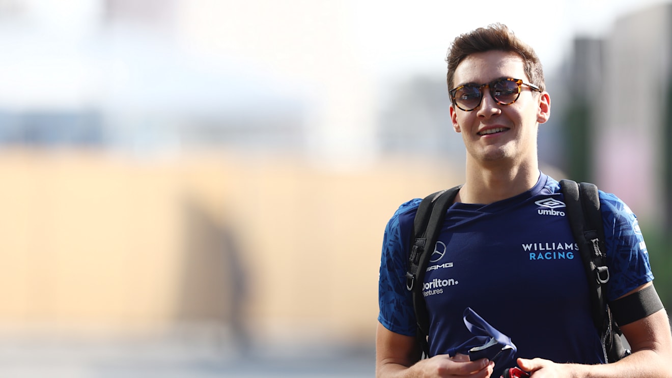 JEDDAH, SAUDI ARABIA - DECEMBER 03: George Russell of Great Britain and Williams walks in the Paddock before practice ahead of the F1 Grand Prix of Saudi Arabia at Jeddah Corniche Circuit on December 03, 2021 in Jeddah, Saudi Arabia. (Photo by Mark Thompson/Getty Images)
