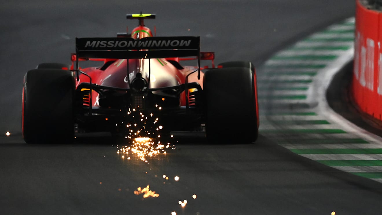 JEDDAH, SAUDI ARABIA - DECEMBER 04: Sparks fly behind Carlos Sainz of Spain driving the (55) Scuderia Ferrari SF21 during final practice ahead of the F1 Grand Prix of Saudi Arabia at Jeddah Corniche Circuit on December 04, 2021 in Jeddah, Saudi Arabia. (Photo by Dan Mullan/Getty Images)