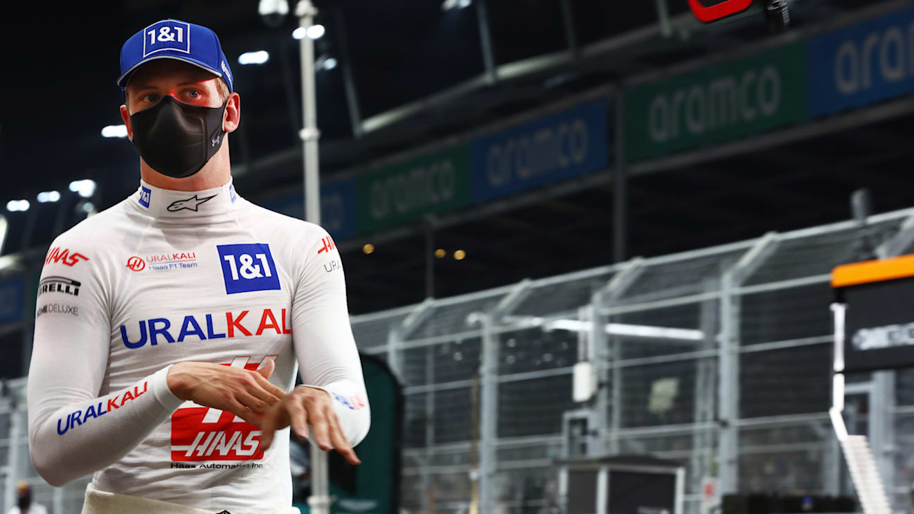 JEDDAH, SAUDI ARABIA - DECEMBER 04: Mick Schumacher of Germany and Haas F1 walks in the Pitlane during qualifying ahead of the F1 Grand Prix of Saudi Arabia at Jeddah Corniche Circuit on December 04, 2021 in Jeddah, Saudi Arabia. (Photo by Mark Thompson/Getty Images)